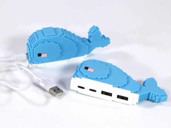 USB-Hub im kreativen Wal-Design mit mehreren Anschlüssen für Datenübertragung und USB-Verbindung.